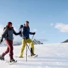 Ciaspolata sulla neve in Trentino nella Val di Sole