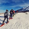 Ciaspolata sulla neve in Trentino nella Val di Sole