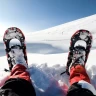 Ciaspolata sulla neve in Trentino nella Val di Sole